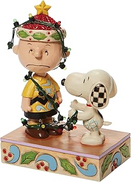 酷牌库|商品详情-Enesco进口代理批发 Jim Shore Charlie Brown 的《Enesco Peanuts》《魔发奇缘》灯光雕像，5.875 英寸，多色