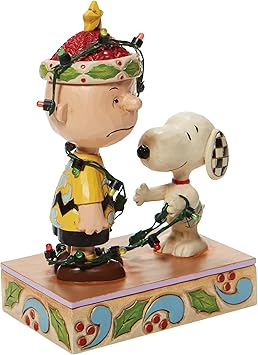 酷牌库|商品详情-Enesco进口代理批发 Jim Shore Charlie Brown 的《Enesco Peanuts》《魔发奇缘》灯光雕像，5.875 英寸，多色