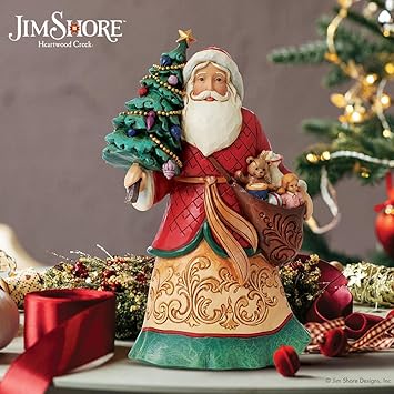 酷牌库|商品详情-Enesco进口代理批发 Enesco Jim Shore Heartwood Creek 圣诞老人抱着圣诞树和玩具袋雕像，8.07 英寸，多色