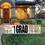 Beistle 53823 Plastic Jumbo Grad Yard Sign, tri-fold design; 3 metal stakes included; all-weather; assembly required, 11&#190;" x 3' 11"