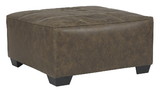 Benjara BM210835 Oversized Ottoman with Tapered Block Legs and Jumbo Stitching in Brown