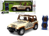 Jada 32426  1992 Jeep Wrangler Tan and Brown with Graphics and Extra Wheels 