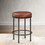 Michael Caramel Faux Leather and Metal Backless Counter Height Stool B050126339