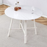 A modern minimalist circular dining table with a 42 inch diameter white patterned tabletop and white metal legs. Suitable for restaurants, living rooms, and conference rooms. W1151P152778