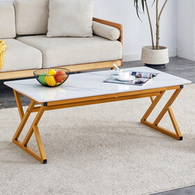 A modern minimalist style white marble patterned coffee table with golden metal legs. Computer desk. Game table. Tea table.