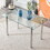 minimalist glass dining table. a transparent tempered glass desktop with a thickness of 0.3 feet and Silver metal legs. Suitable for restaurants and living rooms. 51"*31.4"*29.5" W1151S00346