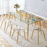 Table and chair set.Modern rectangular glass dining table with tempered glass countertop and golden metal legs, paired with multiple transparent high-quality PET dining chairs with golden legs.