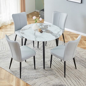 Table and chair set. Large modern white imitation marble patterned round table with black metal legs. Nice minimalism, comfortable seats and black metal legs. W1151S01438