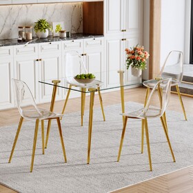 Table and chair set.Modern Luxurious Rectangular Tempered Glass Dining Table Set- with 4 Transparent Plastic Chairs with Gold Metal Legs.Bring a comfortable home experience to the kitchen.W1151S03791