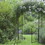Outsunny 85" Garden Arch Arbor, Metal Arch Trellis with Gate, Garden Archway for Climbing Vines, Wedding Ceremony Decoration, Black