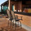 Outsunny Set of 2 Outdoor Swivel Bar Stools with Armrests, Bar Height Patio Chairs with Steel Frame for Balcony, Poolside, Backyard, Brown