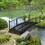 Outsunny 7' Metal Arch Garden Bridge with Safety Siderails, Decorative Arc Footbridge with Delicate Scrollwork"S" Motifs for Backyard Creek, Stream, Fish Pond, Black