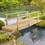 Outsunny 7' Wooden Garden Bridge with Safety Rails, Backyard Footbridge for Ponds, Creeks, Streams, Natural