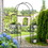 Outsunny 7' Garden Arch Arbor, Metal Arch Trellis with Gate, Garden Archway for Climbing Vines, Wedding Ceremony Decoration, Black W2225P200806