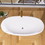 59" Acrylic Freestanding Bathtub Gloss White Modern Stand Alone Soaking Tub Adjustable with Integrated Slotted Overflow and Chrome Pop-up Drain Anti-clogging Easy to Install W99570979