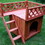 ALEKO DH28X20X25WD-AP Cedar Wooden Dog Kennel with Side Steps and Balcony - 28 x 20 x 25 Inches