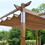 ALEKO PERG10X13LSD-AP Aluminum Outdoor Retractable Pergola with Solar Powered LED Lamps and Wooden Finish  - 13 x 10 Ft - Sand