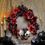 16 3/4" x 3 1/2" Red &amp; Black Flower Wreath with Skulls Halloween Decoration